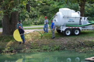 Suction oil skimmer deployment