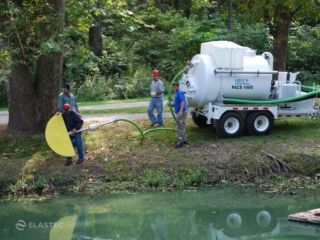 Suction oil skimmer deployment