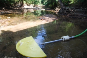 Suction skimmer floating in water
