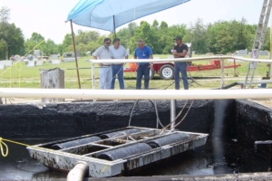 Oil skimmer in pit at graveyard