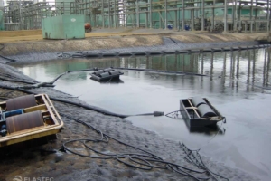 Oil skimmers in industrial pit