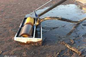 Skimming palm oil from water