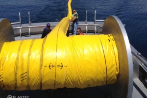 Auto-inflating containment boom on reel