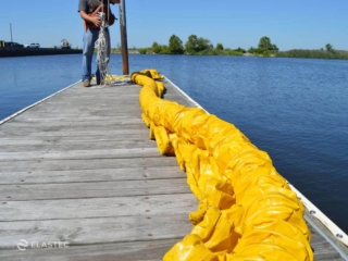 Compacted oil containment boom