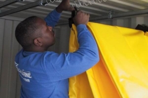 Containment boom on storage hangers
