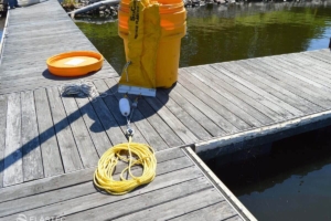 Elastec and Kepner Barrel-O-Boom on dock