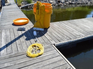 Elastec and Kepner Barrel-O-Boom on dock