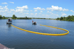 Elastec and Kepner compactible boom towed in a U-formation
