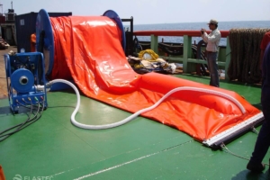 Inflatable boom attached to blower