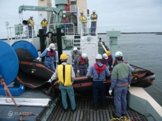Inflating Rubbermax boom sweeping system