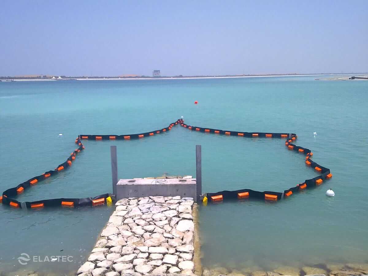 PermaFence containment boom on dock controlling marine life