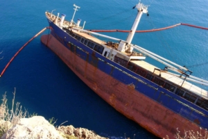 Inflatable boom surrounding ship
