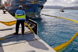 Oil spill fence boom deployment