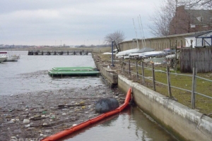 Debris boom deflecting trash