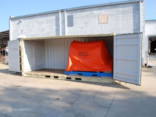 gallery-shoremax-containment-boom-reel-container Shoremax on containment boom reel in container
