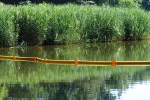 SuperSwamp oil spill containment boom in creek