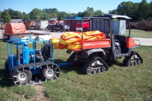 Tundraguard oil boom on specialized vehicle