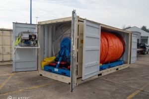 Boom reel in container front and sides open