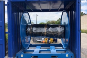 Boom reel in storage container