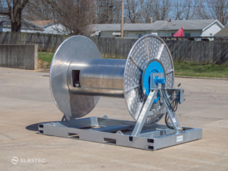 Boom reel with integrated hose