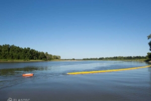 1M BoomVane deploying boom in a river