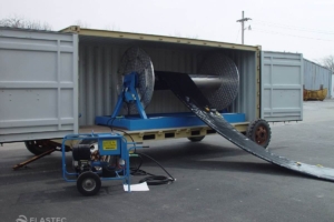 Boom reel in container