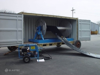 Boom reel in container