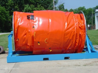 Inflatable containment boom on reel