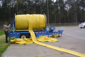 Unrolling boom from a reel