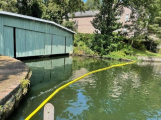 Bottle Boom debris barrier at boat dock