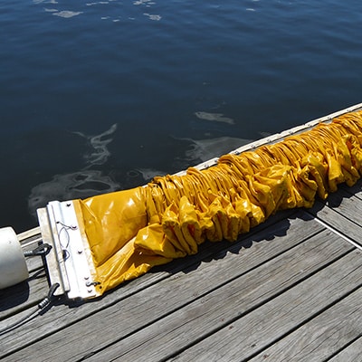 Compactible oil spill containment boom