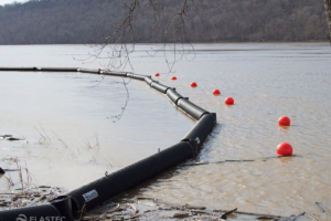 Floating log booms at boat ramp