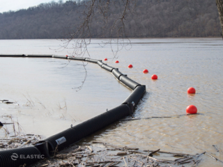 Floating log booms at boat ramp