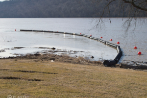Floating log booms on the Ohio River