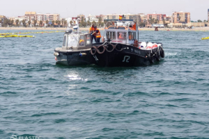 Turbidity curtains towed in water