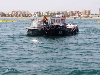 Turbidity curtains towed in water