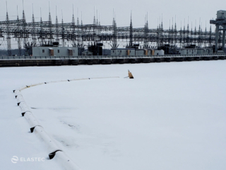 Yellow Elastec Brute Boom in snow and ice