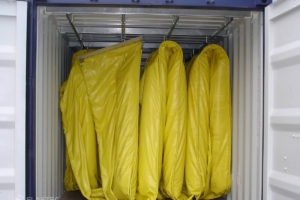 Oil spill response equipment container with boom