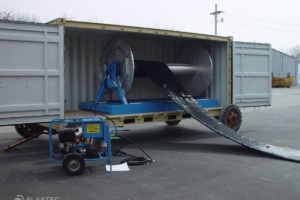 Boom reel being deployed from inside a container