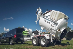 Vacuum trailer system with tilting tank