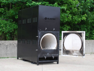Municipal waste incinerator with open door
