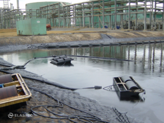 Oil field skimmer recovering oil