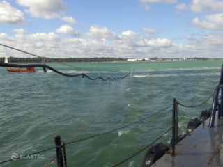 Oil spill dispersant spraying