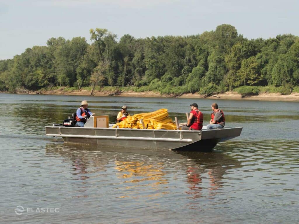 Inlander boat with containment boom