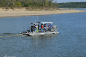 Oil skimmer boat on the river