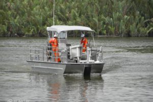 Oil skimmer boat traveling