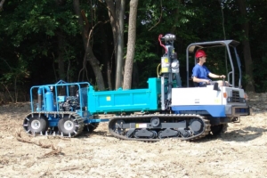 Multi-purpose crawler towing vacuum system