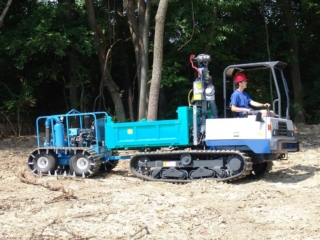 Multi-purpose crawler towing vacuum system