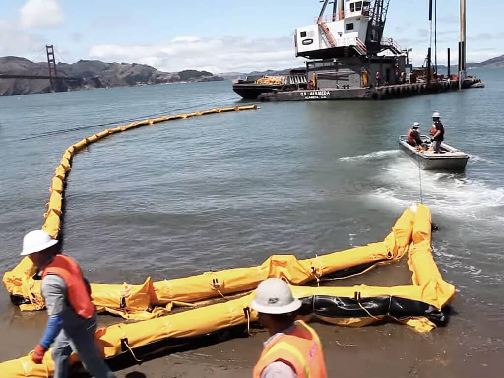 Turbidity curtain being pulled into water