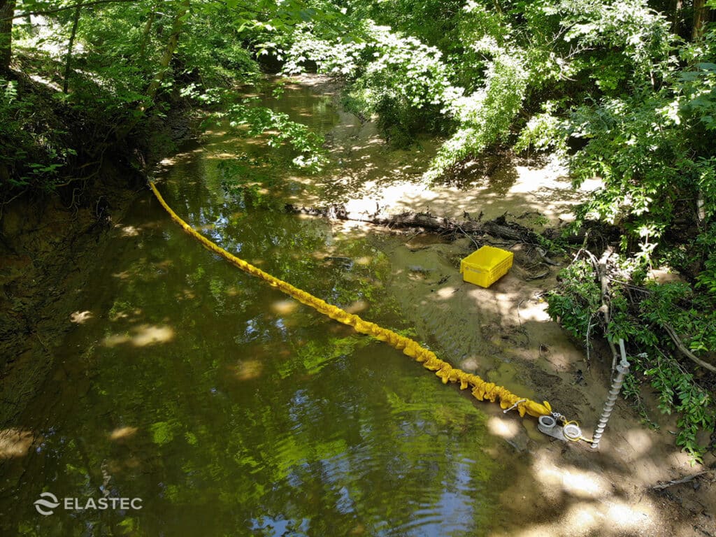 AquaCoil instant oil boom containing a spill